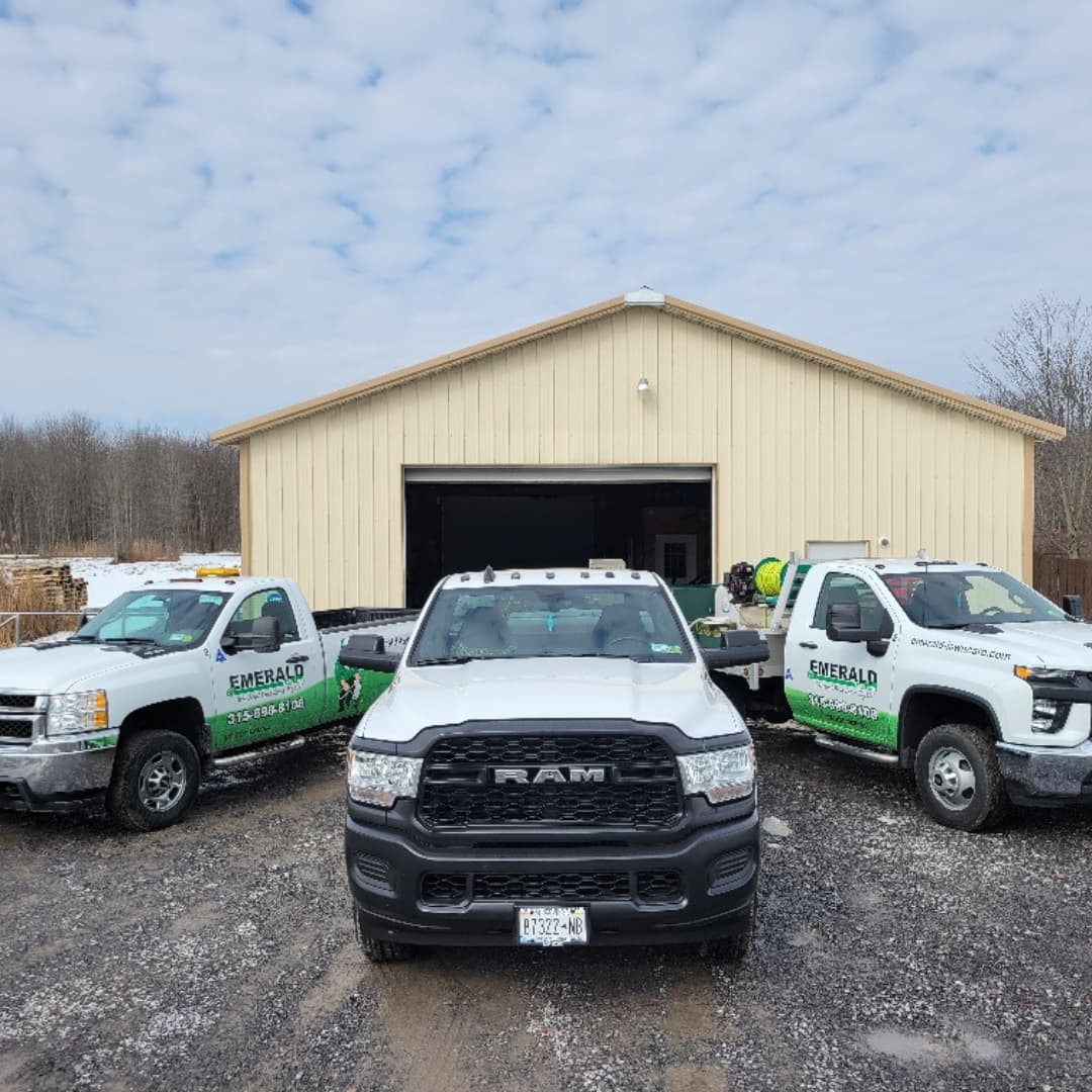 Emerald Lawn Care shop and service vehicles